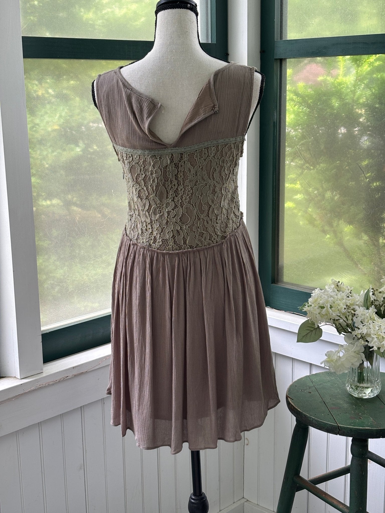 Close-up of button loop detail at back neckline on Hayden Los Angeles taupe lace bodice dress