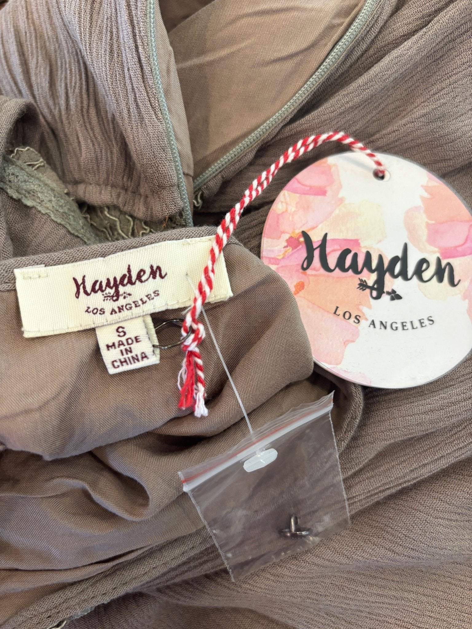 Hayden Los Angeles brand label with size Small and NWT hang tag on taupe lace bodice drop waist dress