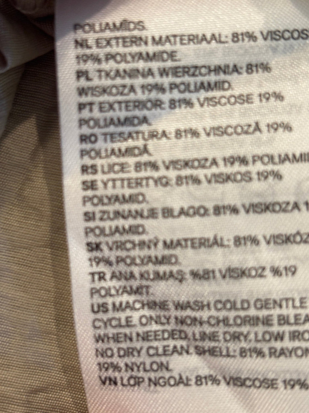 Continuation of care label showing machine wash cold gentle, line dry, low iron, no dry clean instructions