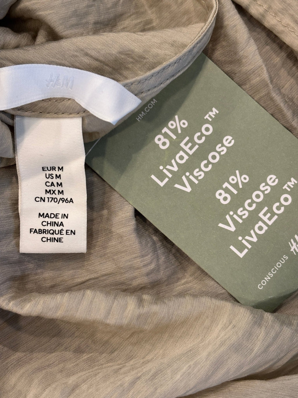 Interior neck label showing H&M brand, size US M, and Made in China