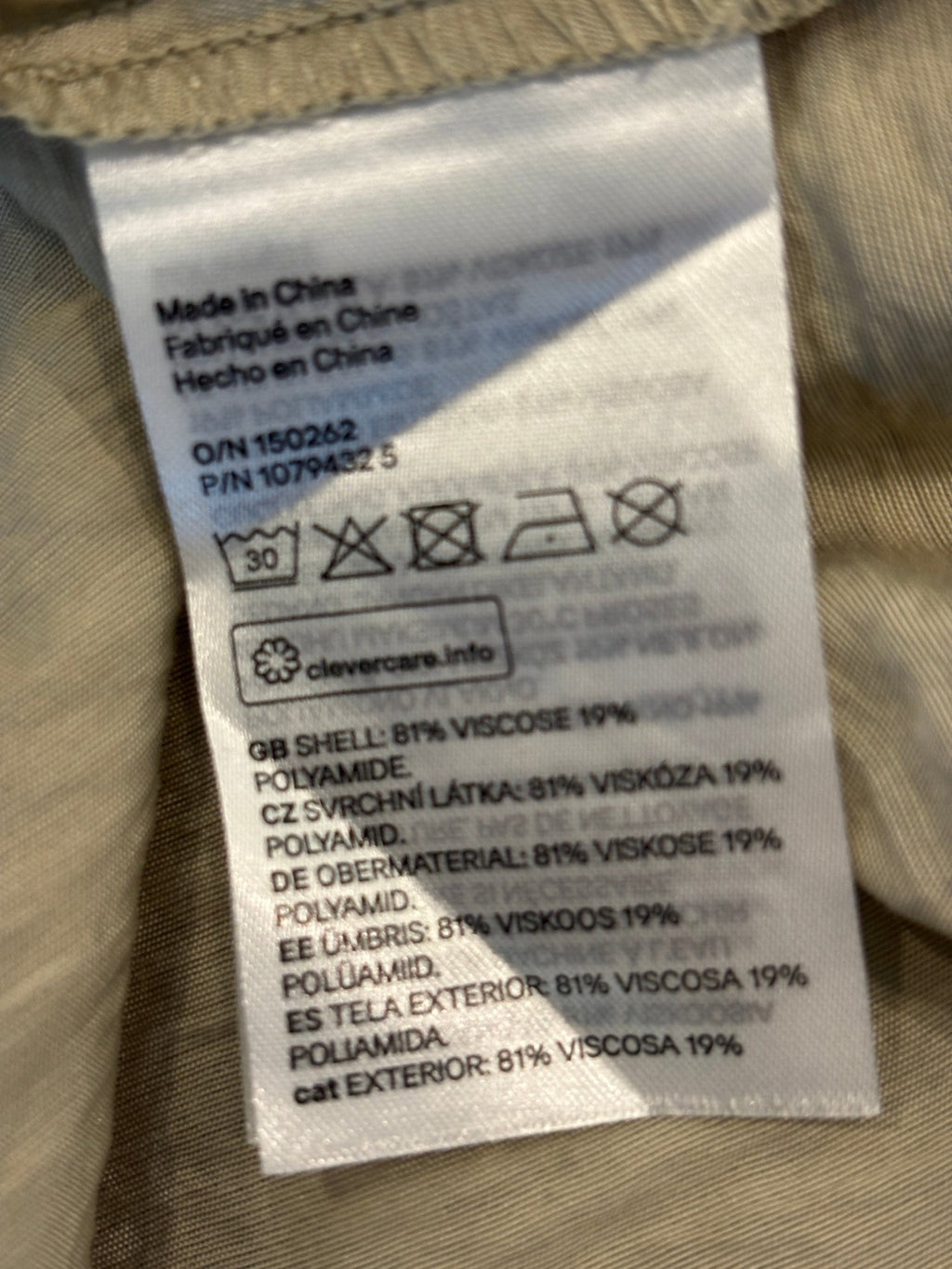 Interior care label showing shell composition 81% viscose 19% polyamide and wash instructions