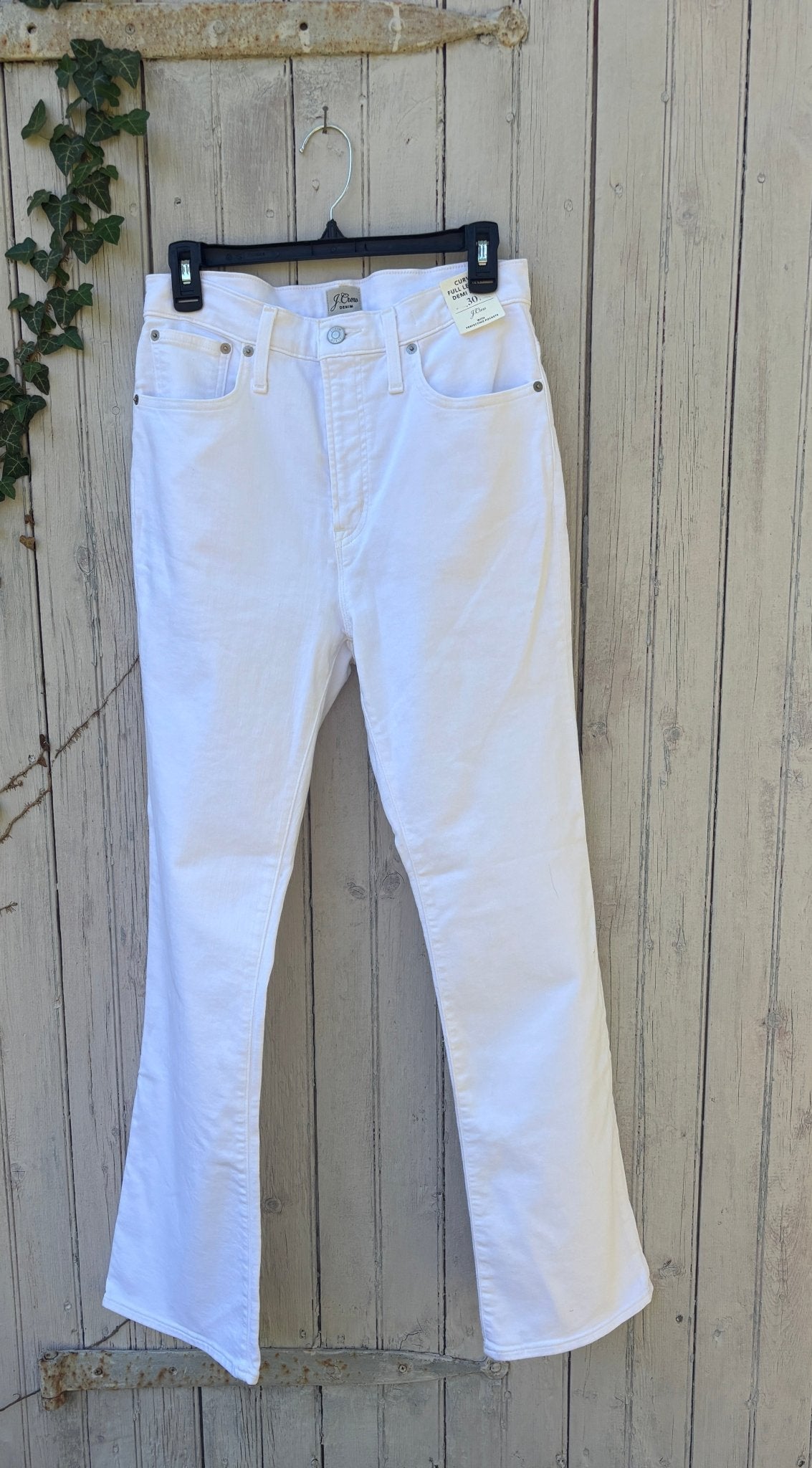 J.Crew Curvy Full Length Demi Boot white jeans hanging on fence, front view showing high rise and flared leg, size 30 NWT