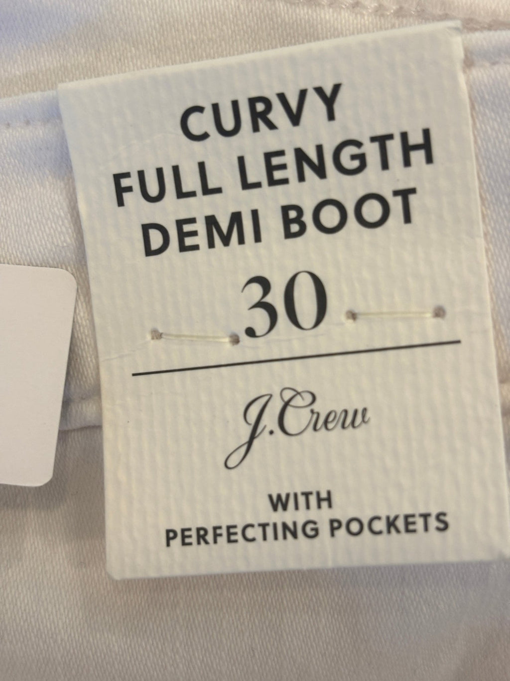 J.Crew hang tag showing Curvy Full Length Demi Boot style, size 30, with Perfecting Pockets detail