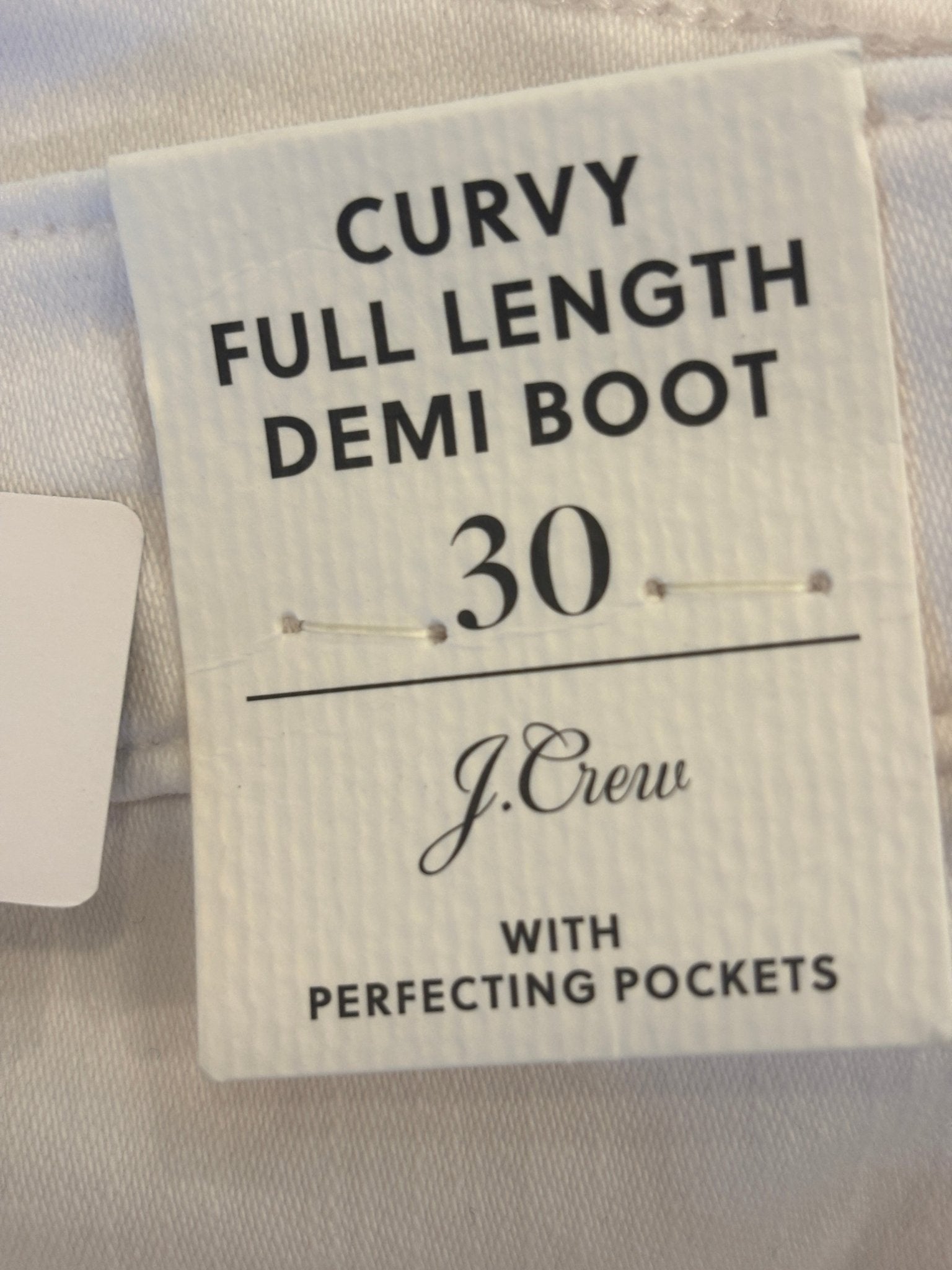 J.Crew hang tag showing Curvy Full Length Demi Boot style, size 30, with Perfecting Pockets detail