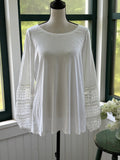 JM Collection white crochet lace bell sleeve top front view on mannequin showing full length and floral lace sleeves, size Medium NWT
