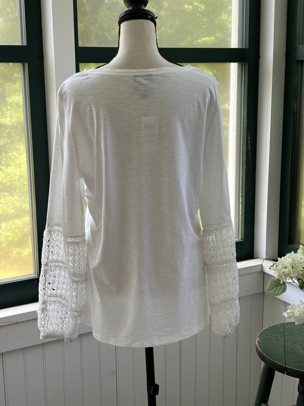 Back view of JM Collection white bell sleeve top showing A-line swing silhouette and lace sleeves