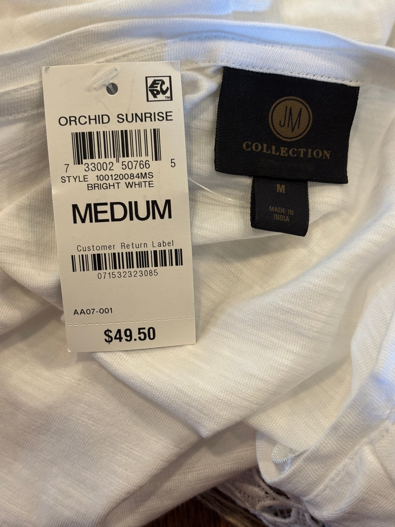 Hang tag showing JM Collection Orchid Sunrise style name size Medium and $49.50 retail price