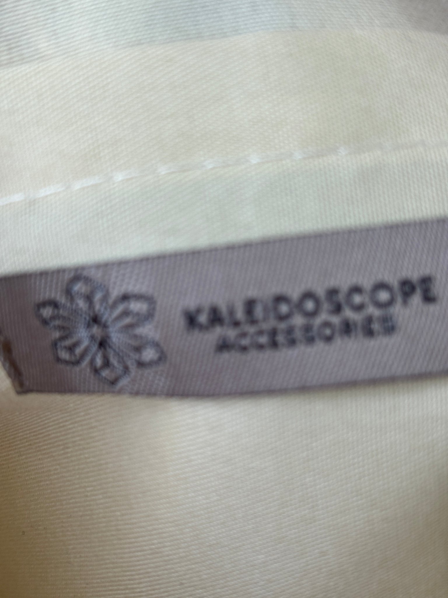 Kaleidoscope Accessories brand label inside natural crochet crossbody bag