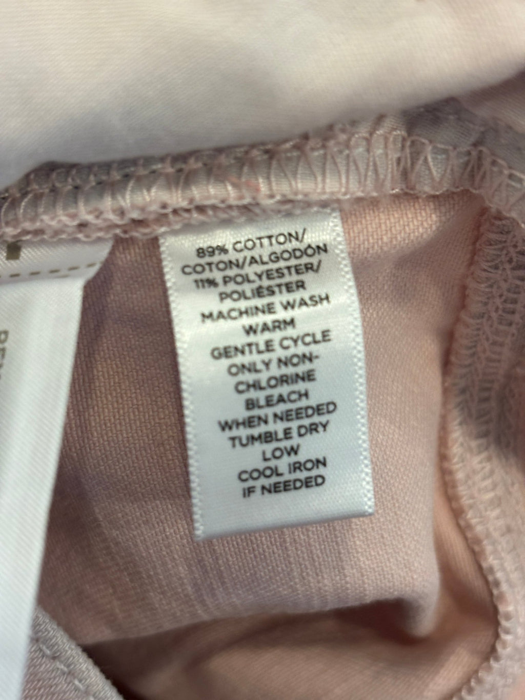 Care label showing 89% cotton 11% polyester fabric content on LOFT crop jeans
