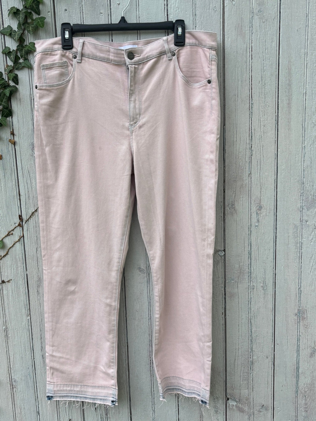 LOFT The Crop blush pink jeans hanging front view showing cropped silhouette and frayed hem, size 14/32