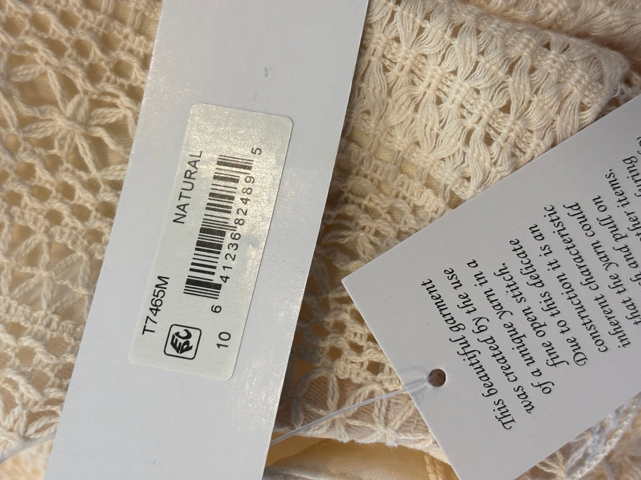 Barcode tag showing natural color and style number T7465M on London Times maxi dress