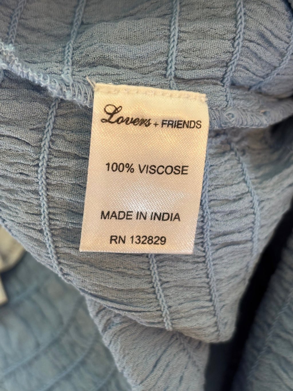 Lovers + Friends fabric content label showing 100% viscose