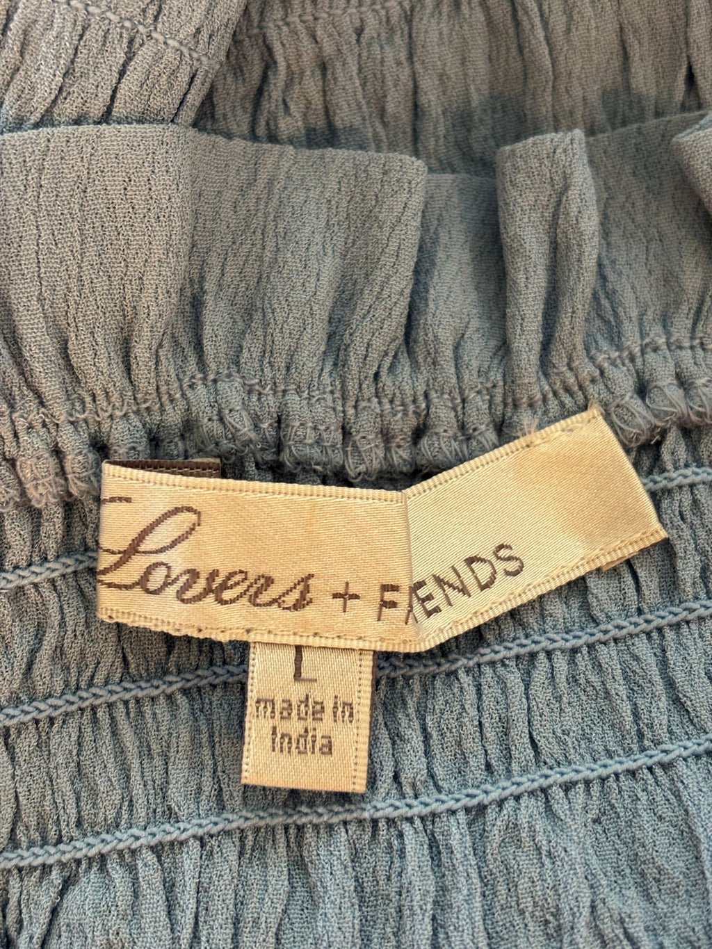 Lovers + Friends brand label showing size Large, made in India