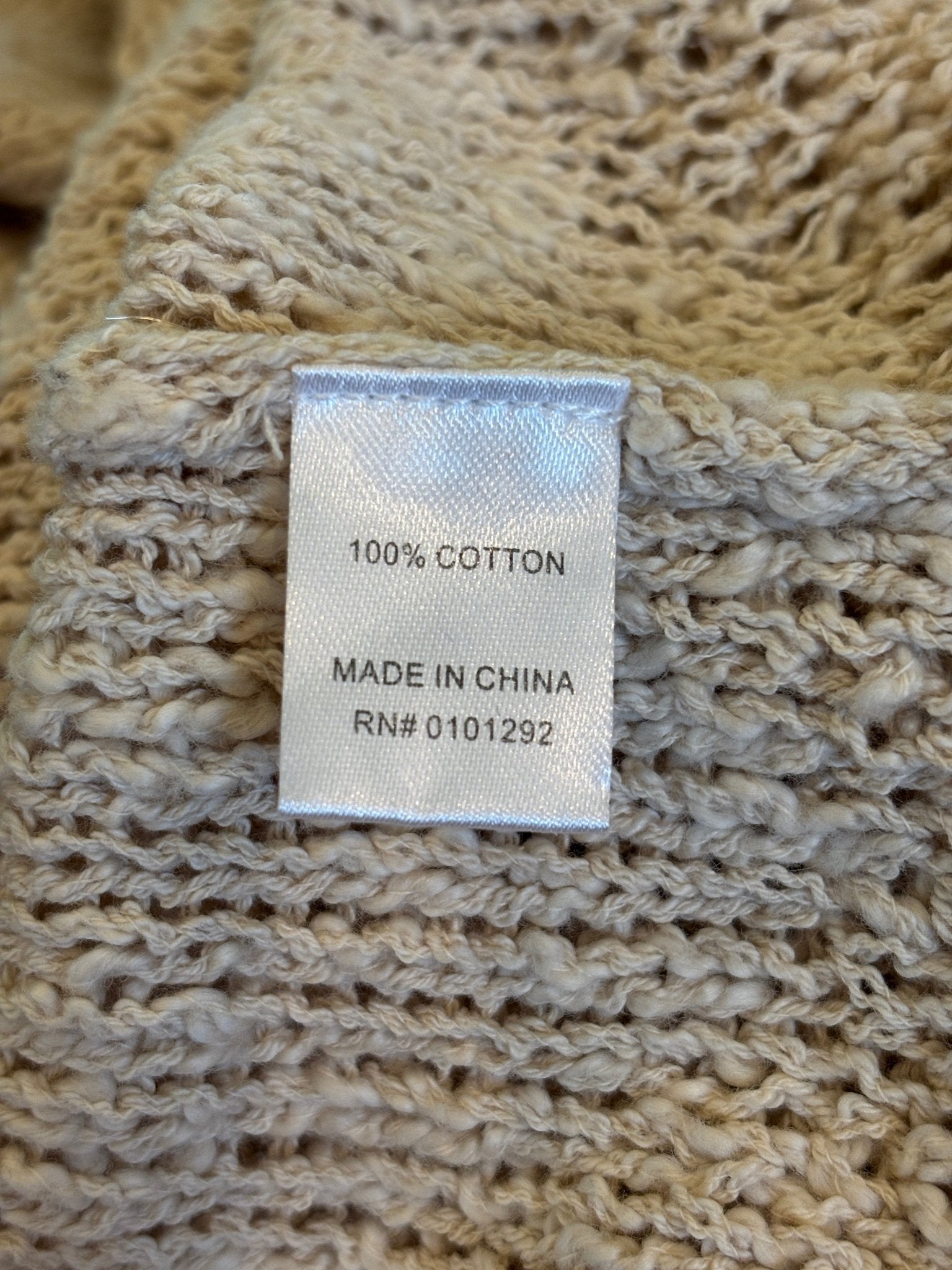 Fabric content label showing 100% cotton for Lulu-B knit cardigan