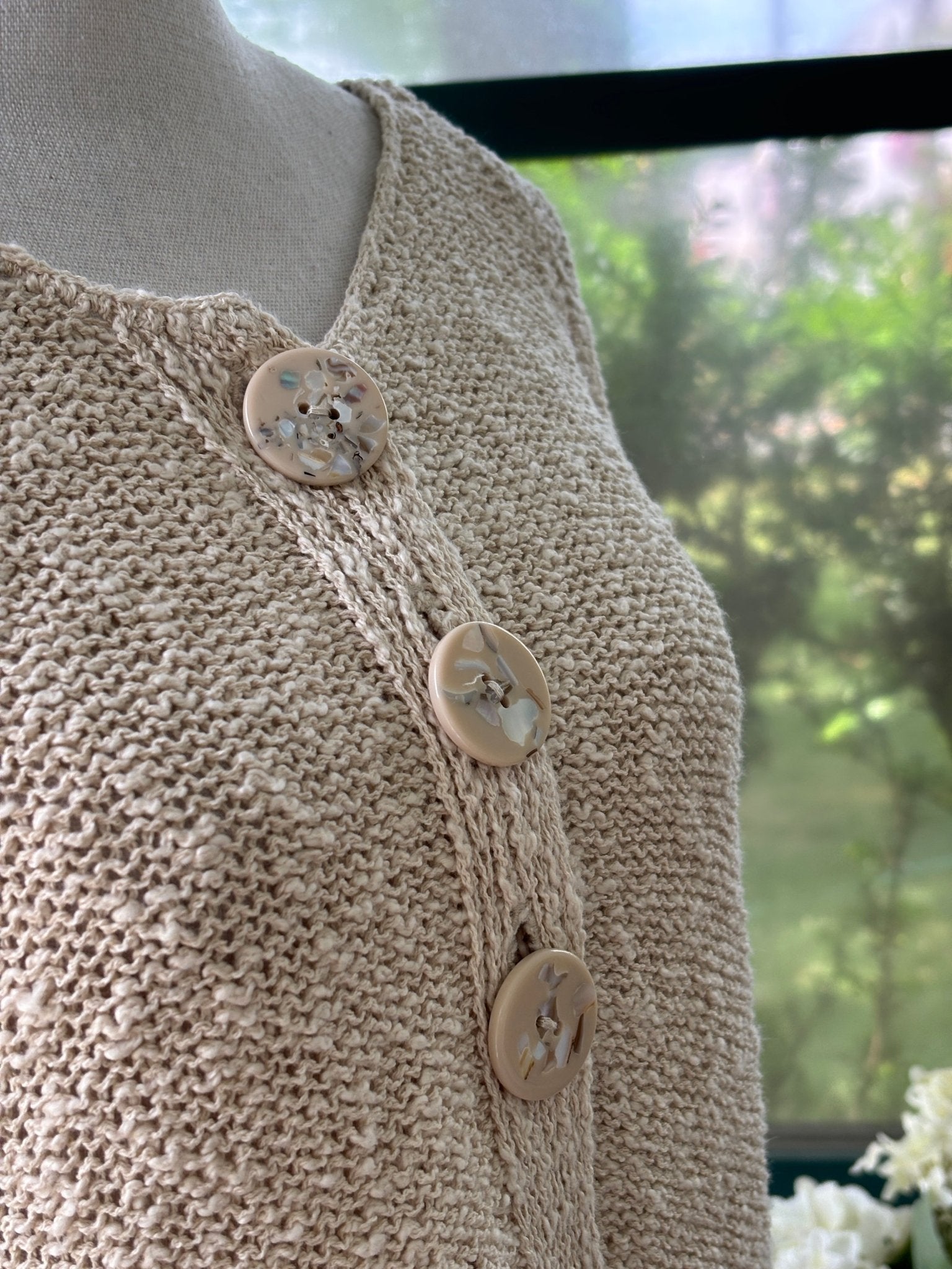 Close-up of oversized statement buttons on Lulu-B oatmeal knit cardigan
