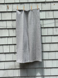 Mango MNG medium grey wide leg pants front view hanging showing full length and clean front seam detail, size Large NWT