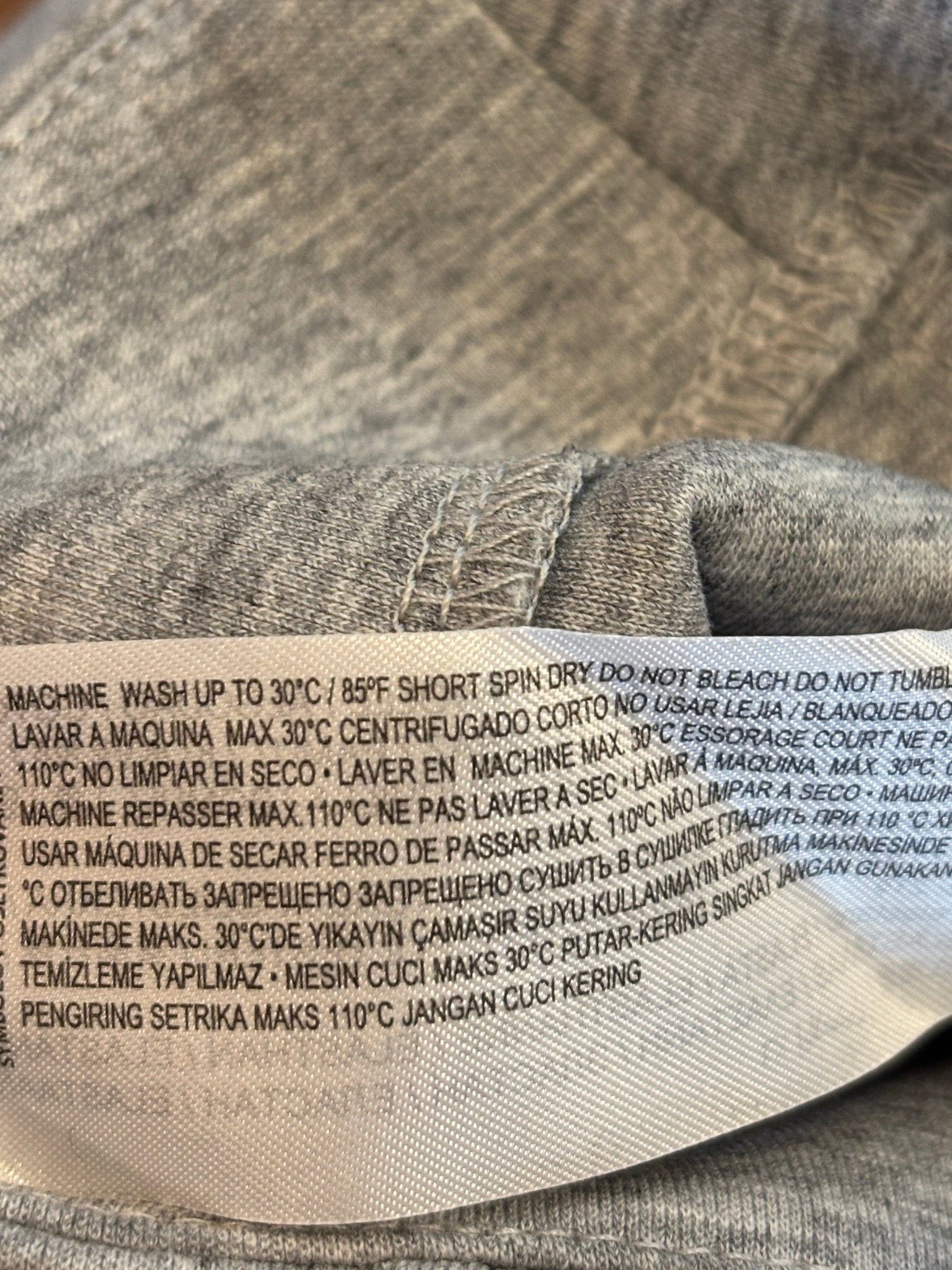 Care instructions label showing machine wash cold details on Mango wide leg pants