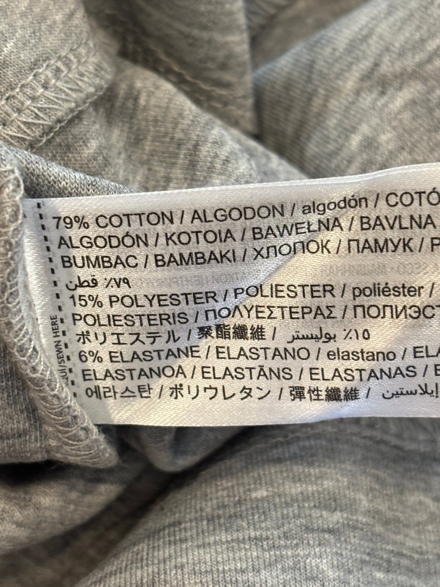 Care label showing 79% cotton 15% polyester 6% elastane fabric content