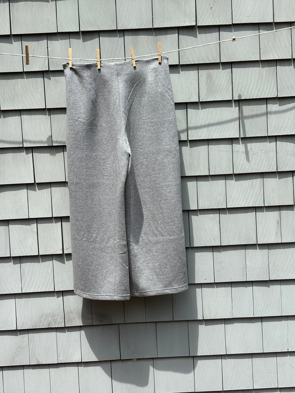 Back view of Mango MNG medium grey wide leg pants showing full silhouette