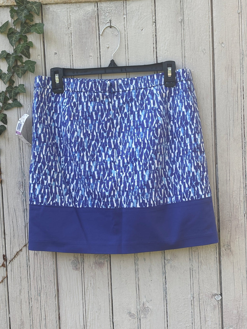 Michael Michael Kors blue print mini skirt, back view showing colorblock hem and zipper