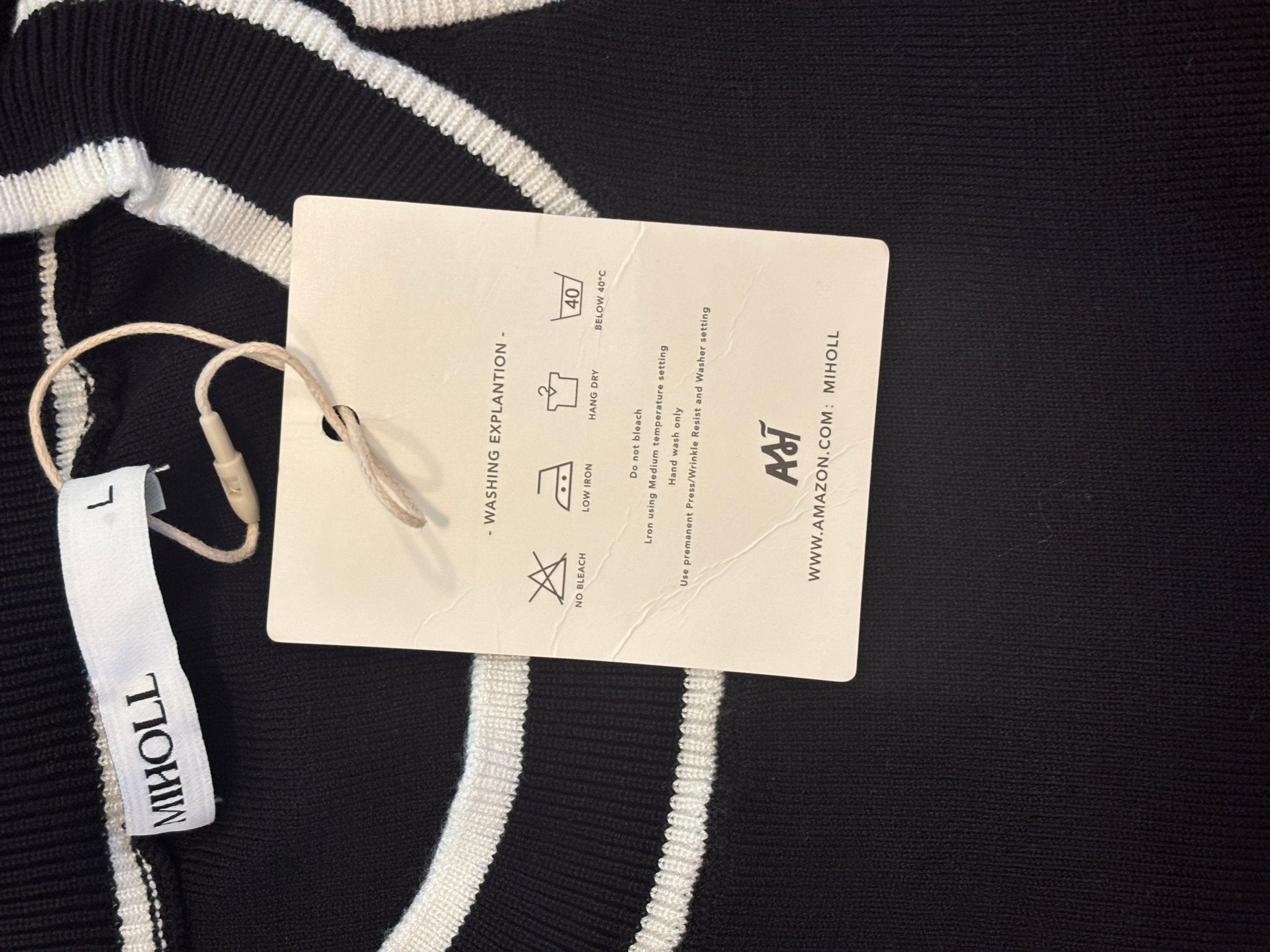 Miholl care tag showing hand wash only, hang dry, low iron instructions