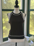 Miholl black knit tank top with white contrast trim at neckline and hem, size large, front view on mannequin