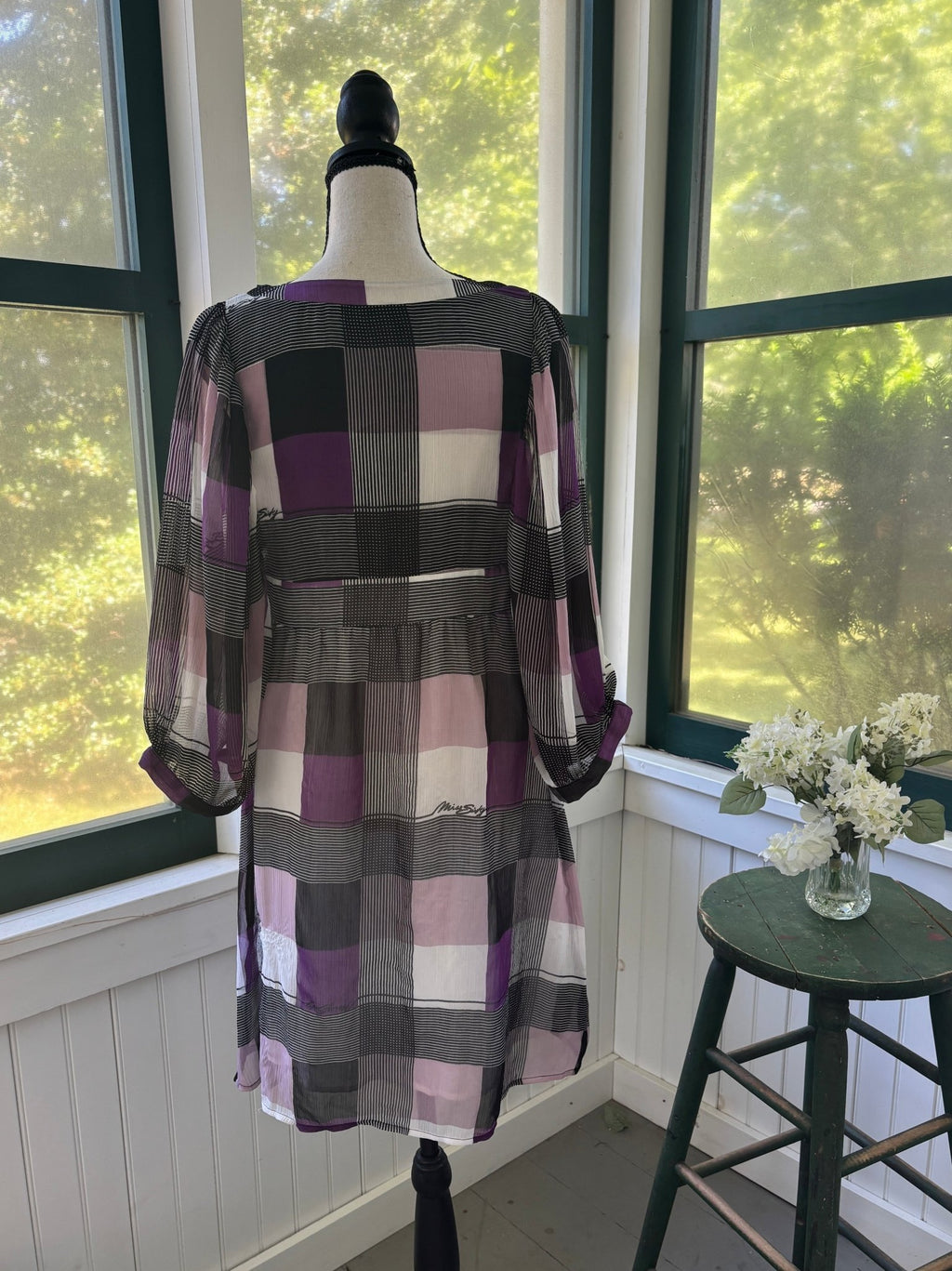 Full back view of Miss Sixty Collection geometric colorblock mini dress on dress form
