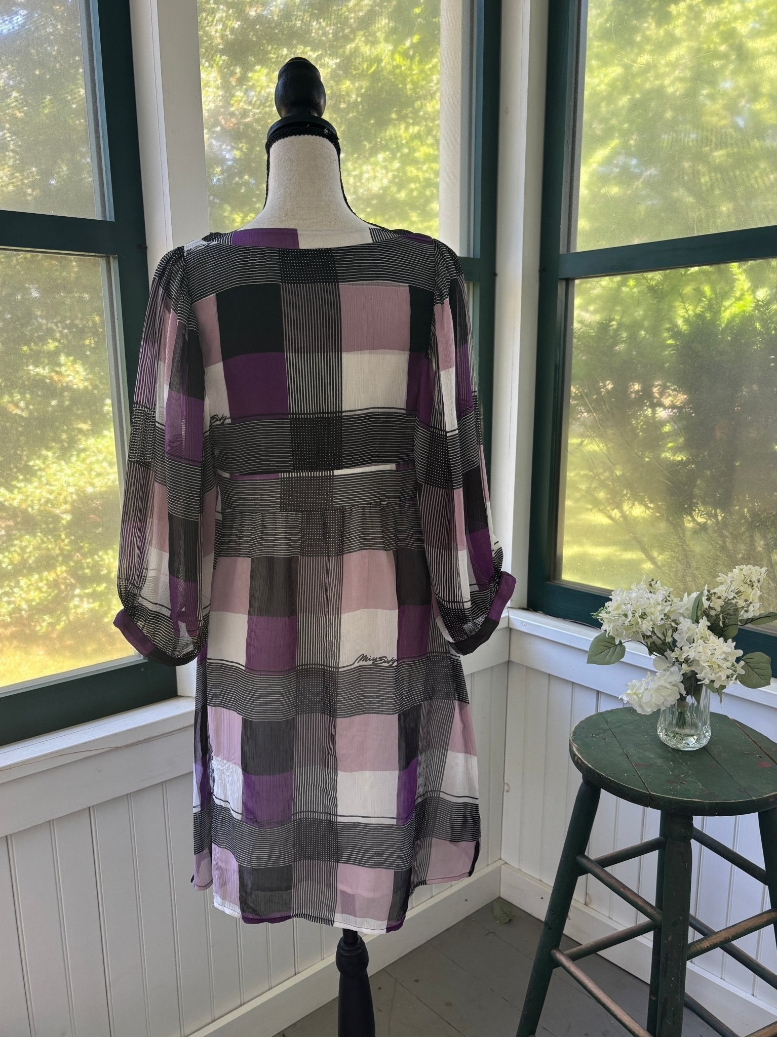 Full back view of Miss Sixty Collection geometric colorblock mini dress on dress form