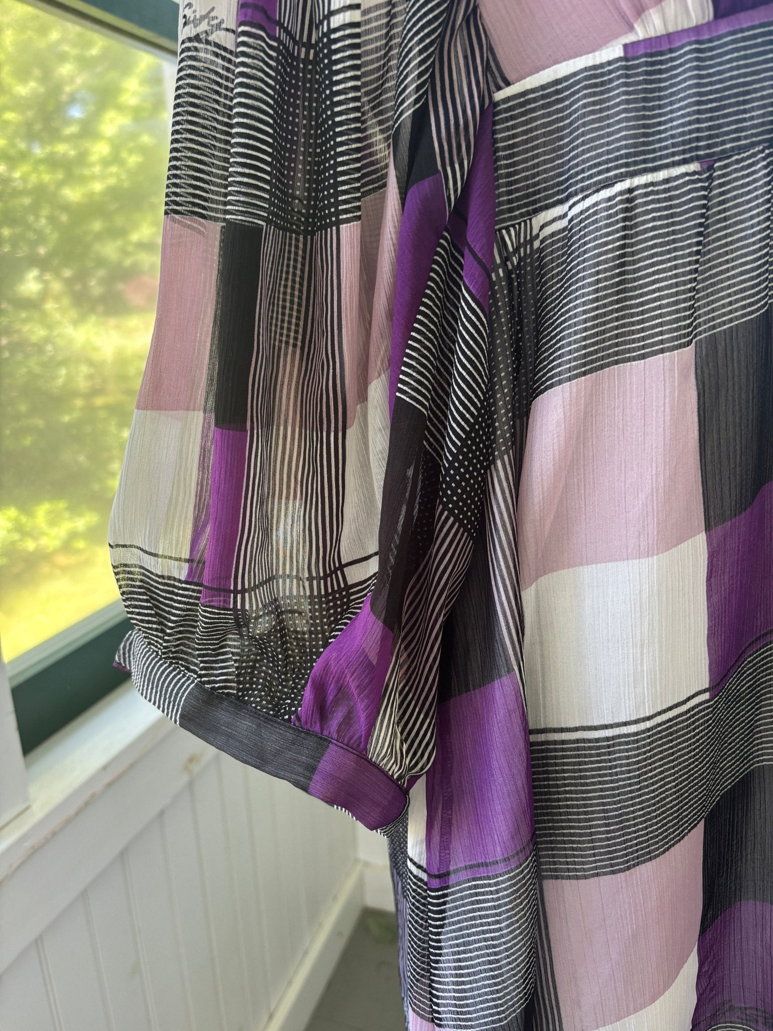 Detail of balloon sleeve with elasticated cuff on Miss Sixty Collection mini dress