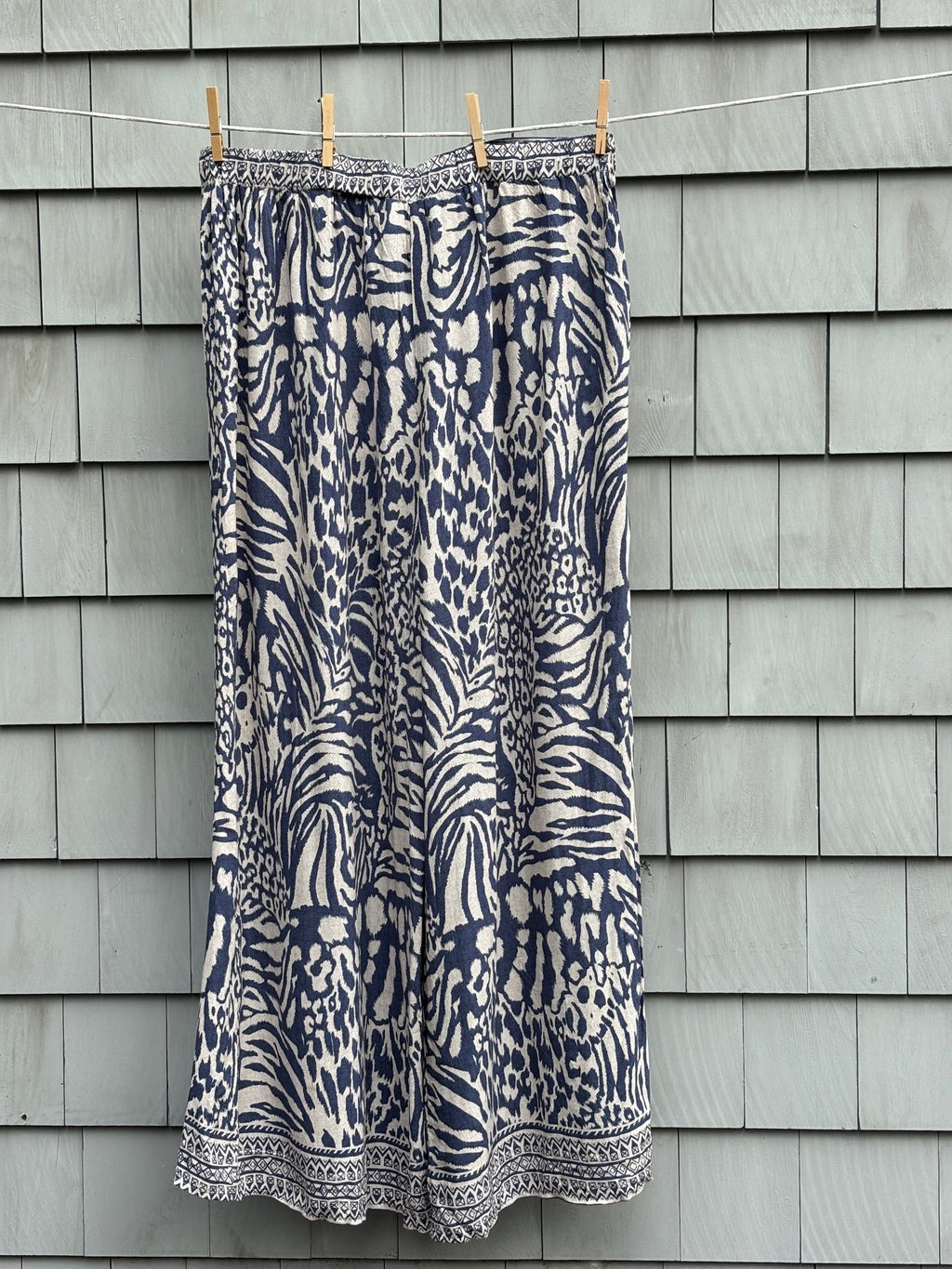 Molly Bracken wide leg pants size XL navy animal print back view elasticated waist clothesline