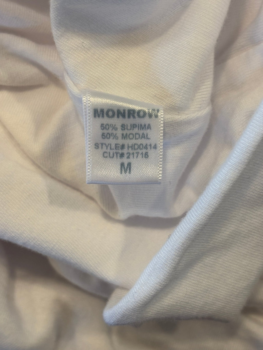 Interior label showing Monrow brand, 50% Supima 50% Modal fabric content, size Medium