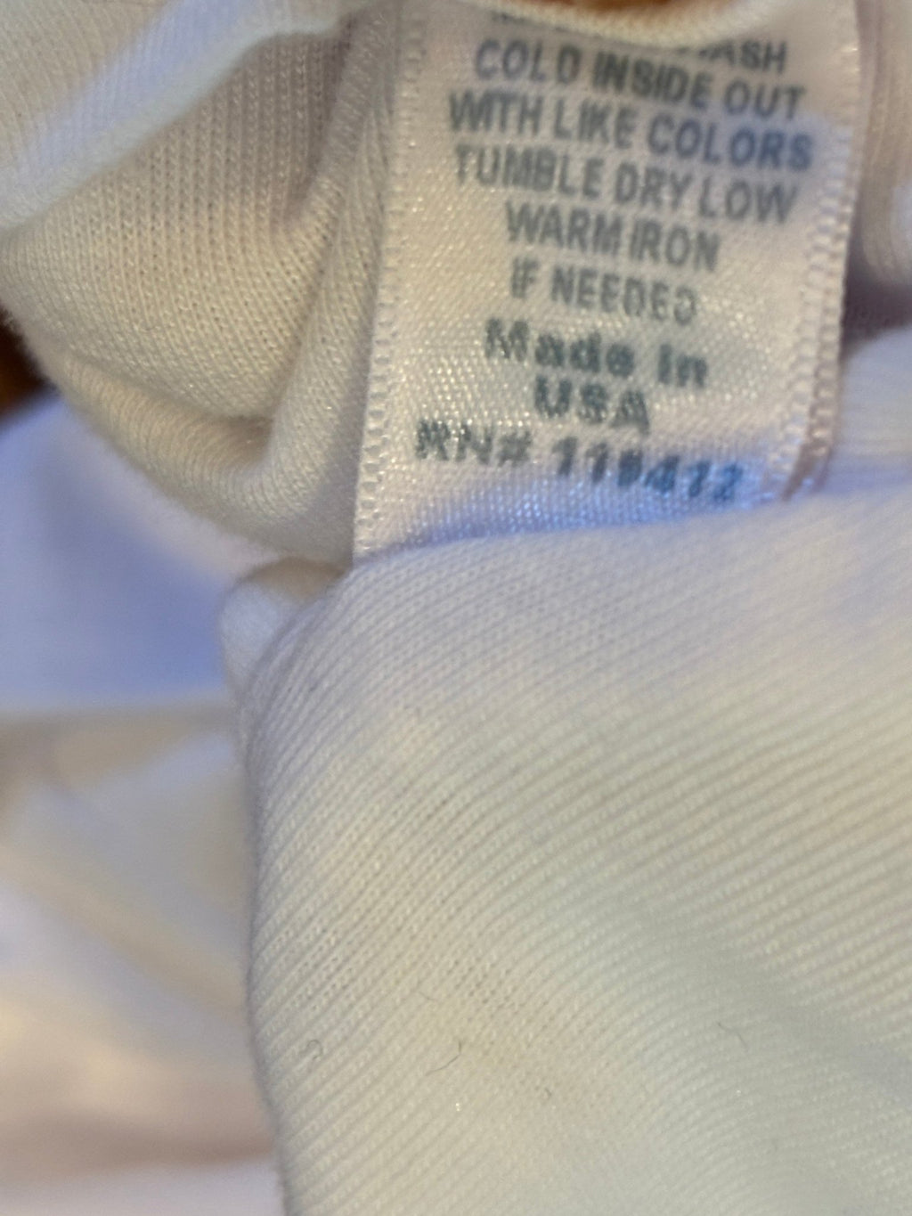 Care label showing cold wash inside out instructions, Made in USA