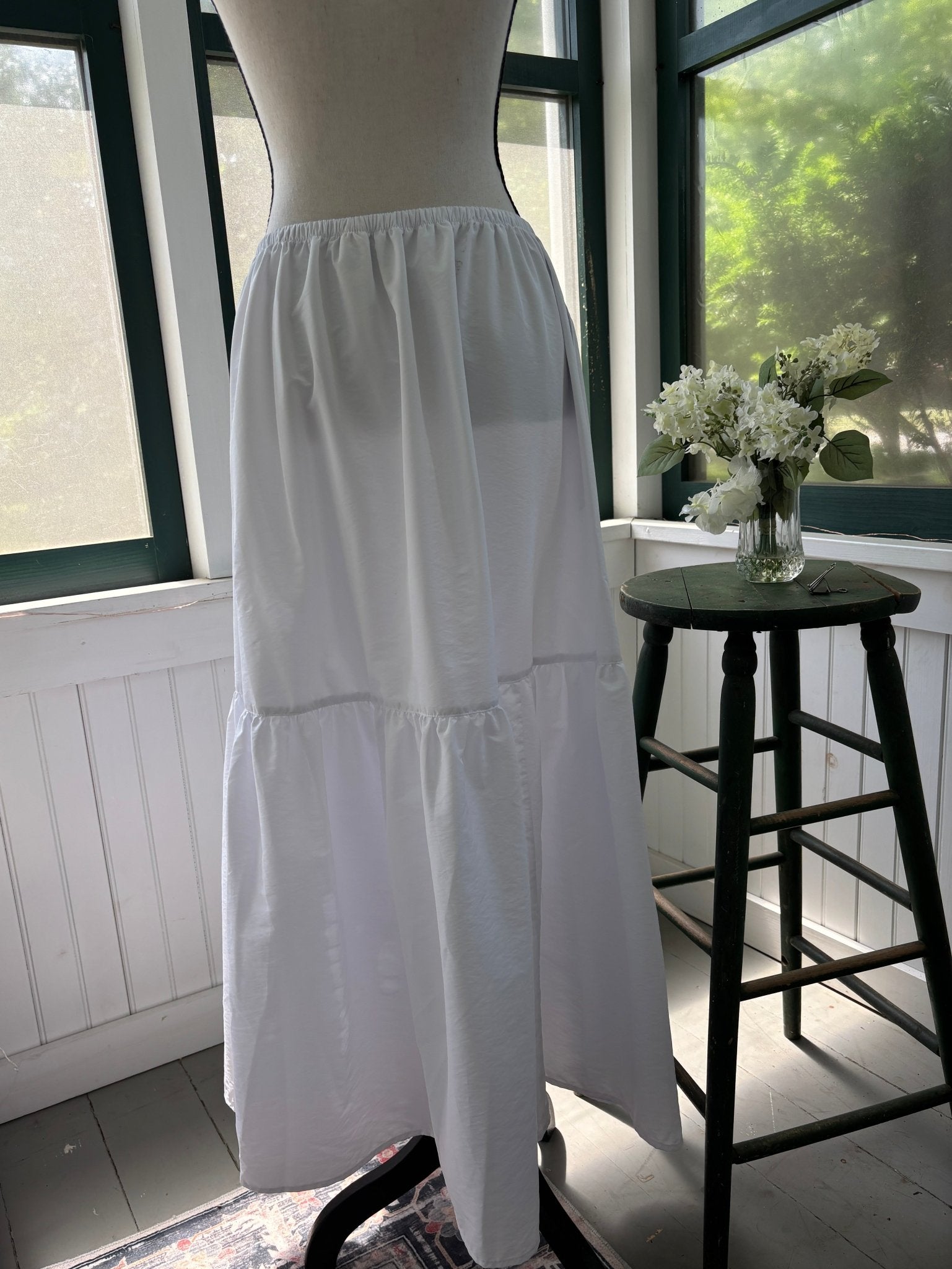 Open Edit white tiered maxi skirt, side view showing tiered silhouette