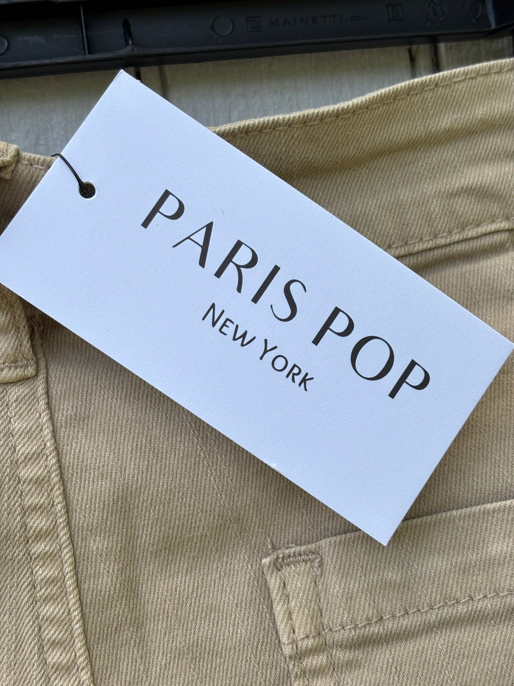 Paris Pop New York brand hang tag showing Paris Pop New York logo