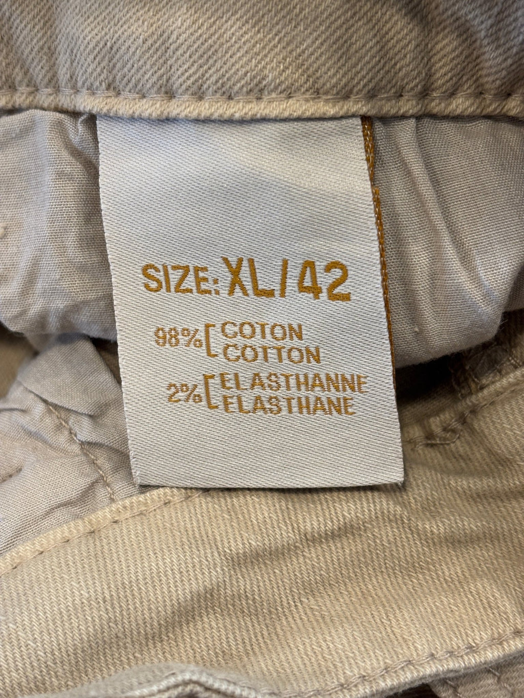 Interior label showing size XL/42 and 98% cotton 2% elasthane fabric content