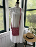 Vera Bradley dusty pink quilted crossbody bag styled on mannequin pre-loved crossbody bags Sassy and Chic