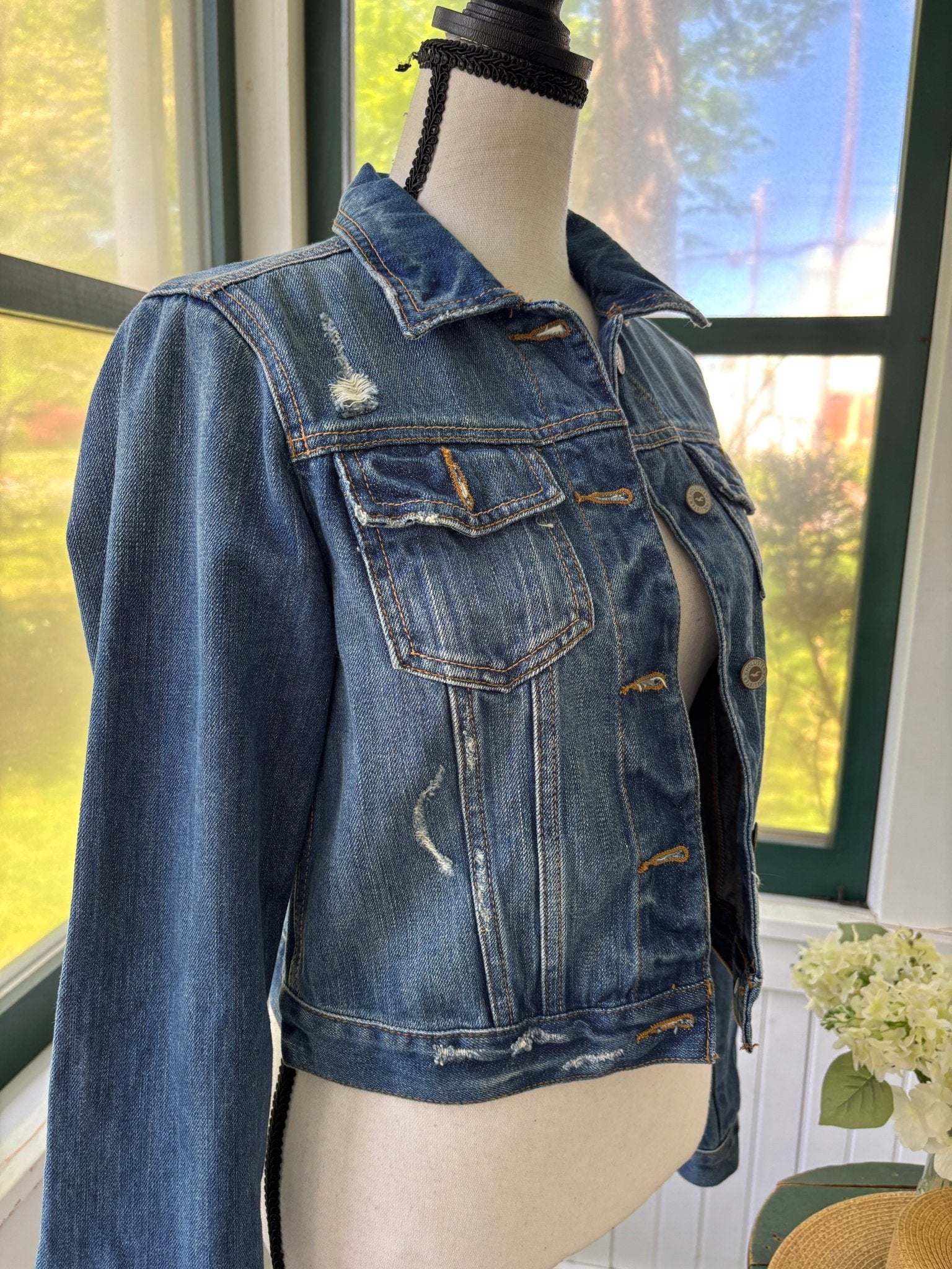 Hollister cropped distressed denim jacket side view distressed details like new Sassy and Chic