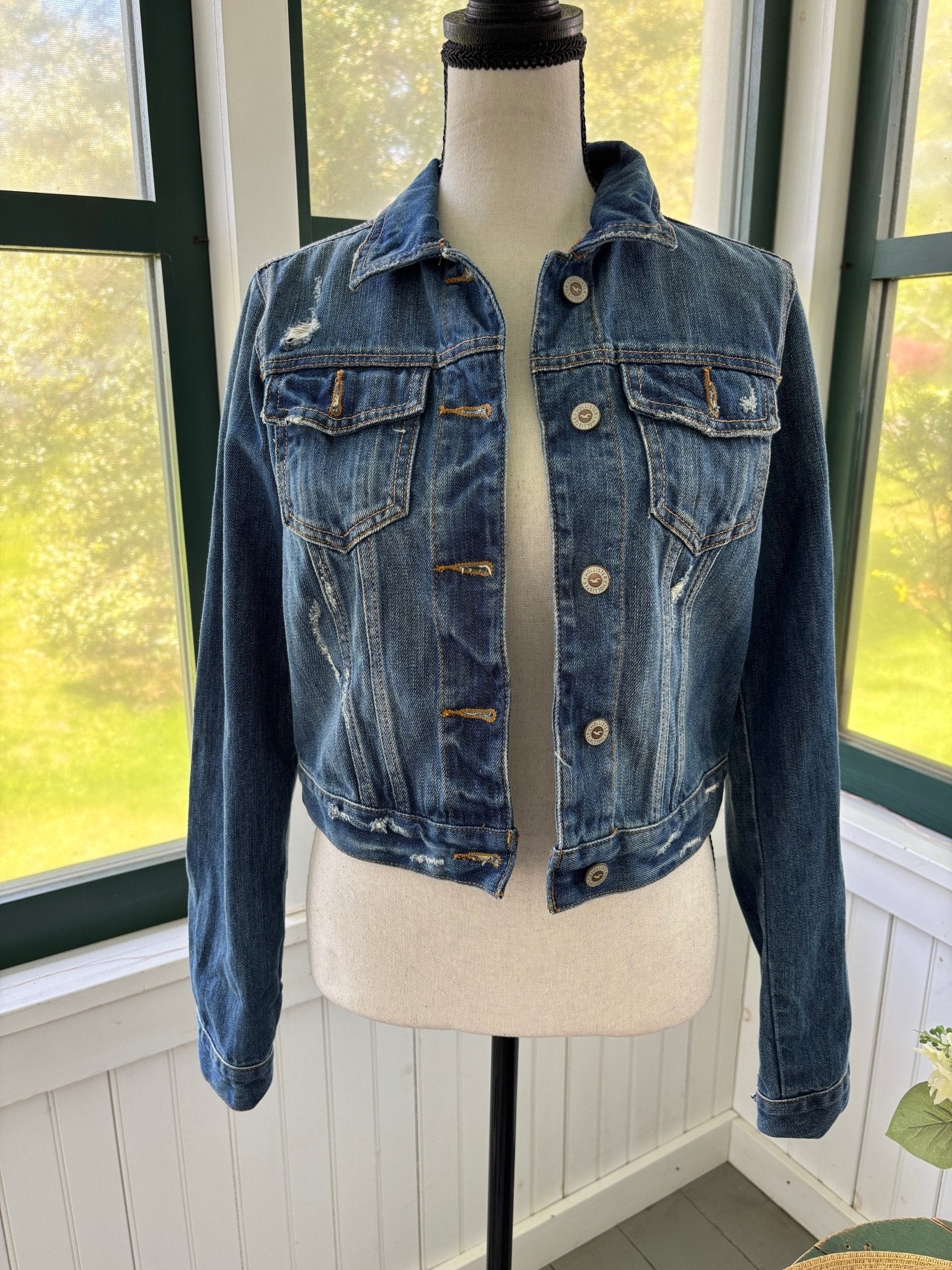 Hollister cropped distressed denim jacket front view button closure pre-loved jackets Sassy and Chic