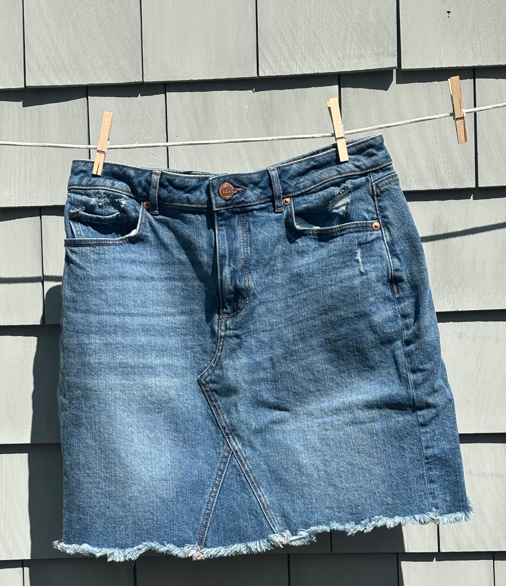 LOFT medium wash denim mini skirt front view high rise waistband pre-loved skirts Sassy and Chic