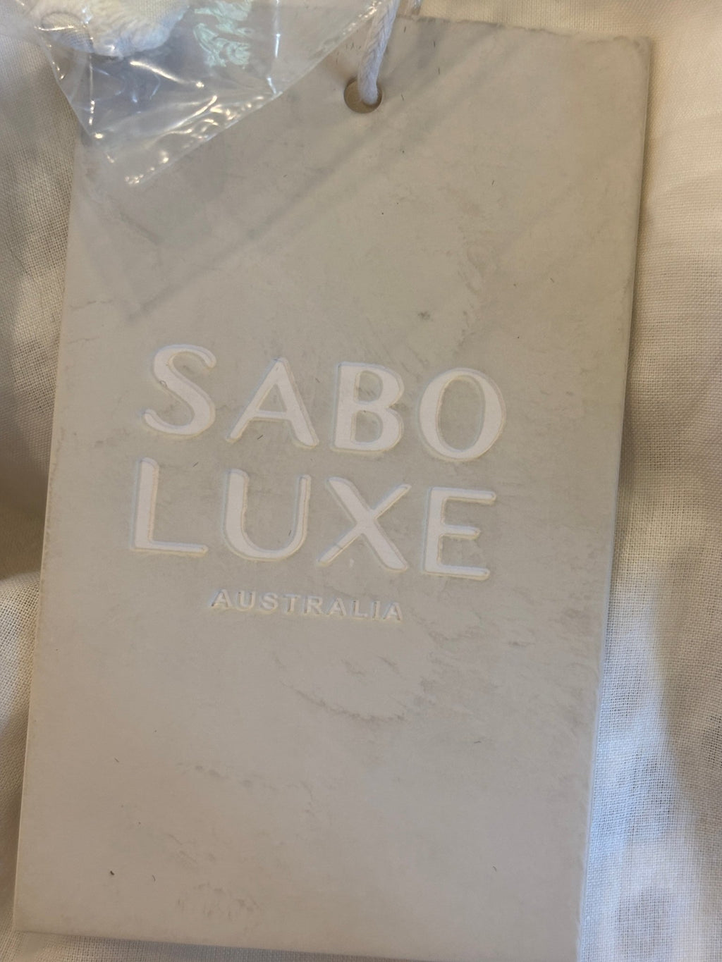 Sabo Luxe Australia brand tag on Tamzyn midi skirt
