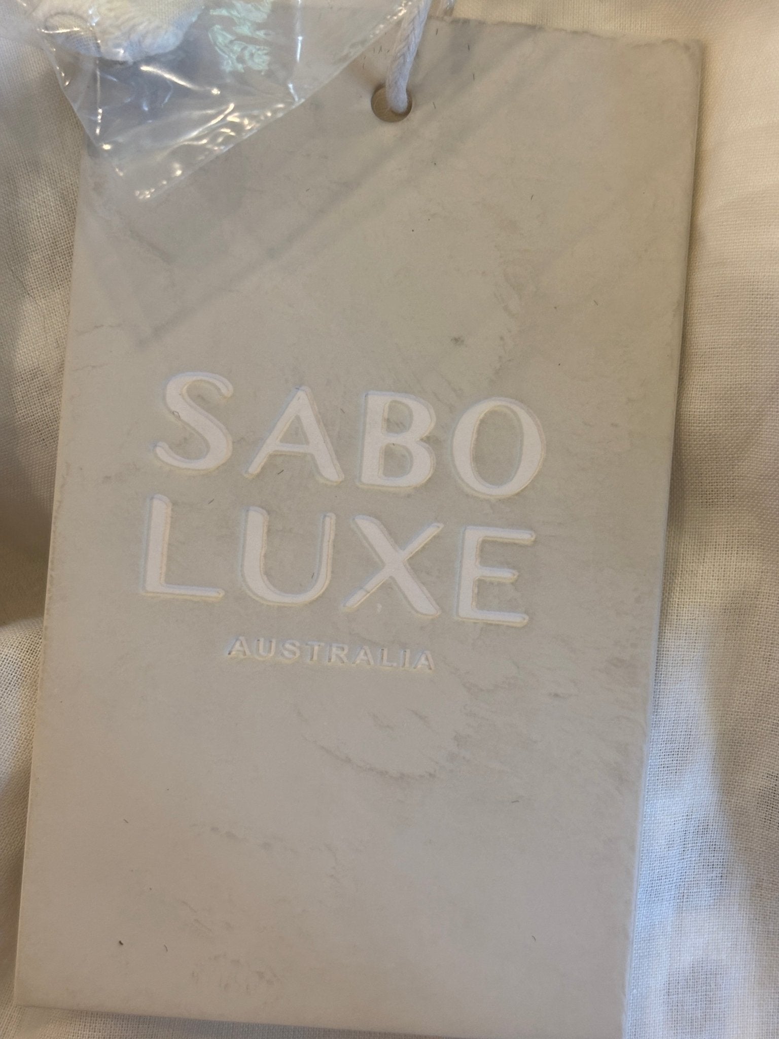 Sabo Luxe Australia brand tag on Tamzyn midi skirt