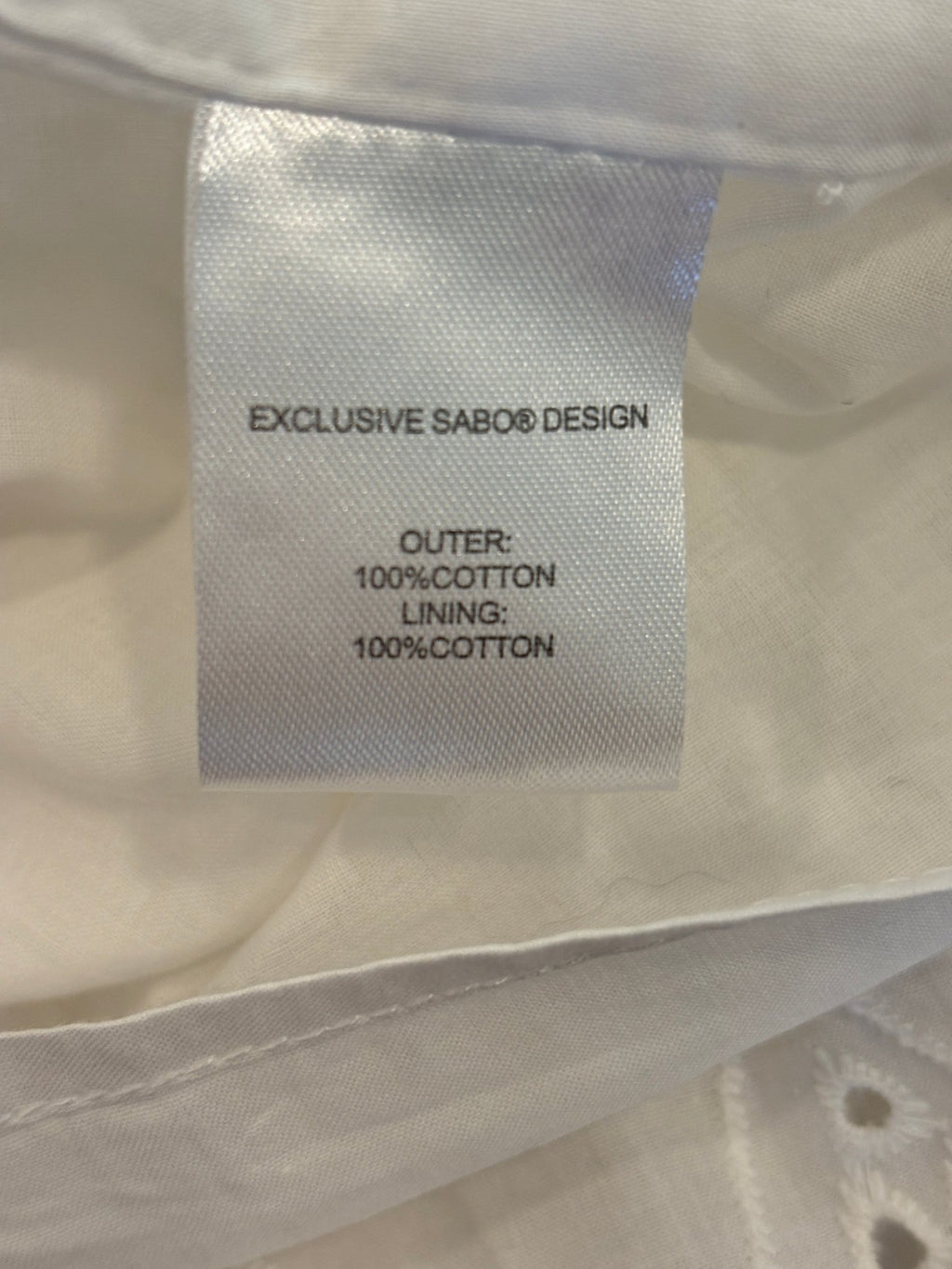 Sabo Luxe care label showing 100% cotton outer and lining