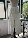 Sabo Luxe Tamzyn white eyelet midi skirt with covered button front, full front view on mannequin