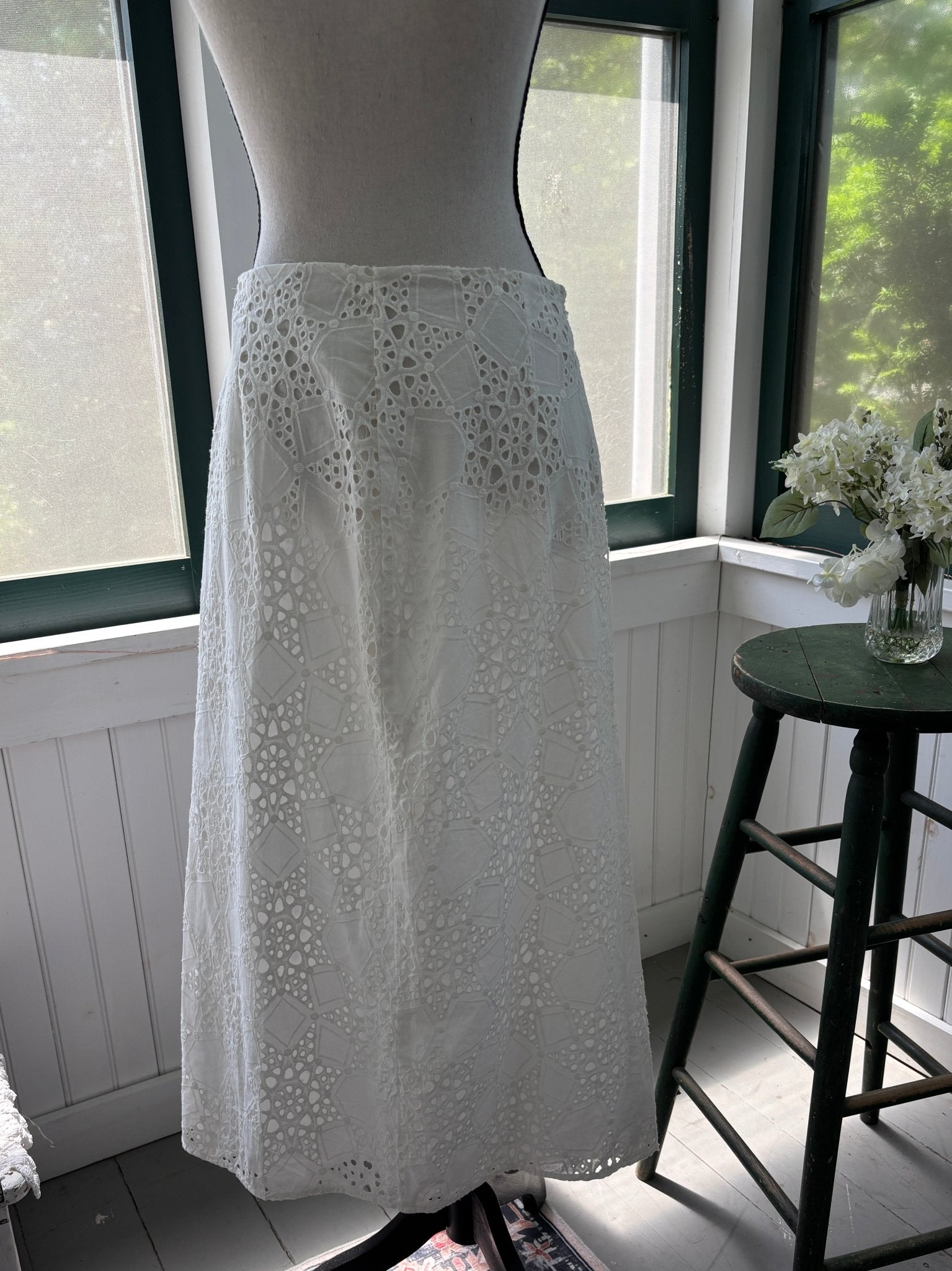 Sabo Luxe white eyelet midi skirt, back view showing high waist and side slit