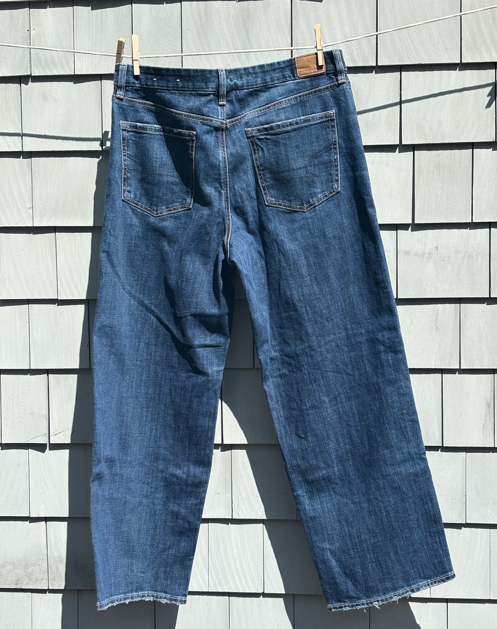AEO Curvy Stovepipe dark wash jeans back view frayed hem brand new tags Sassy and Chic