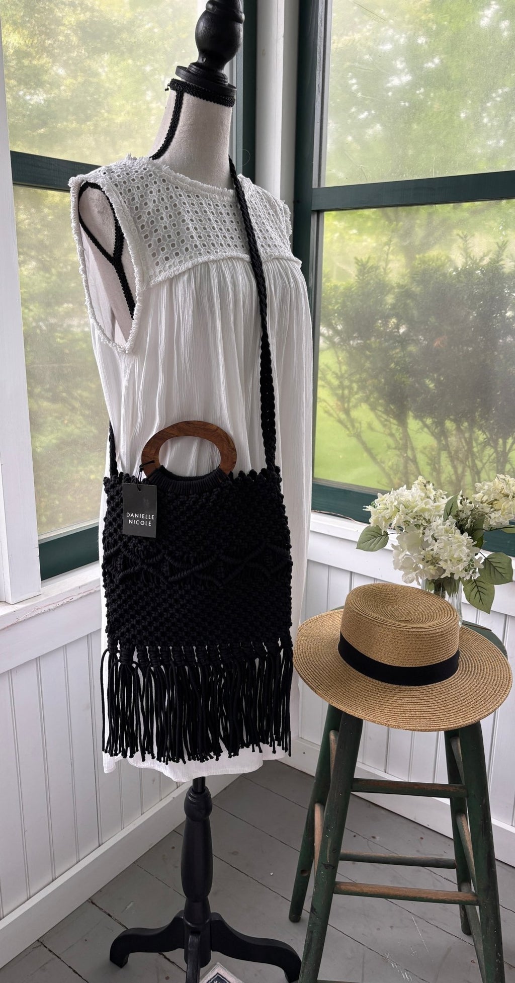 Danielle Nicole black macrame fringe bag styled on mannequin thrifted satchels new with tags Sassy and Chic