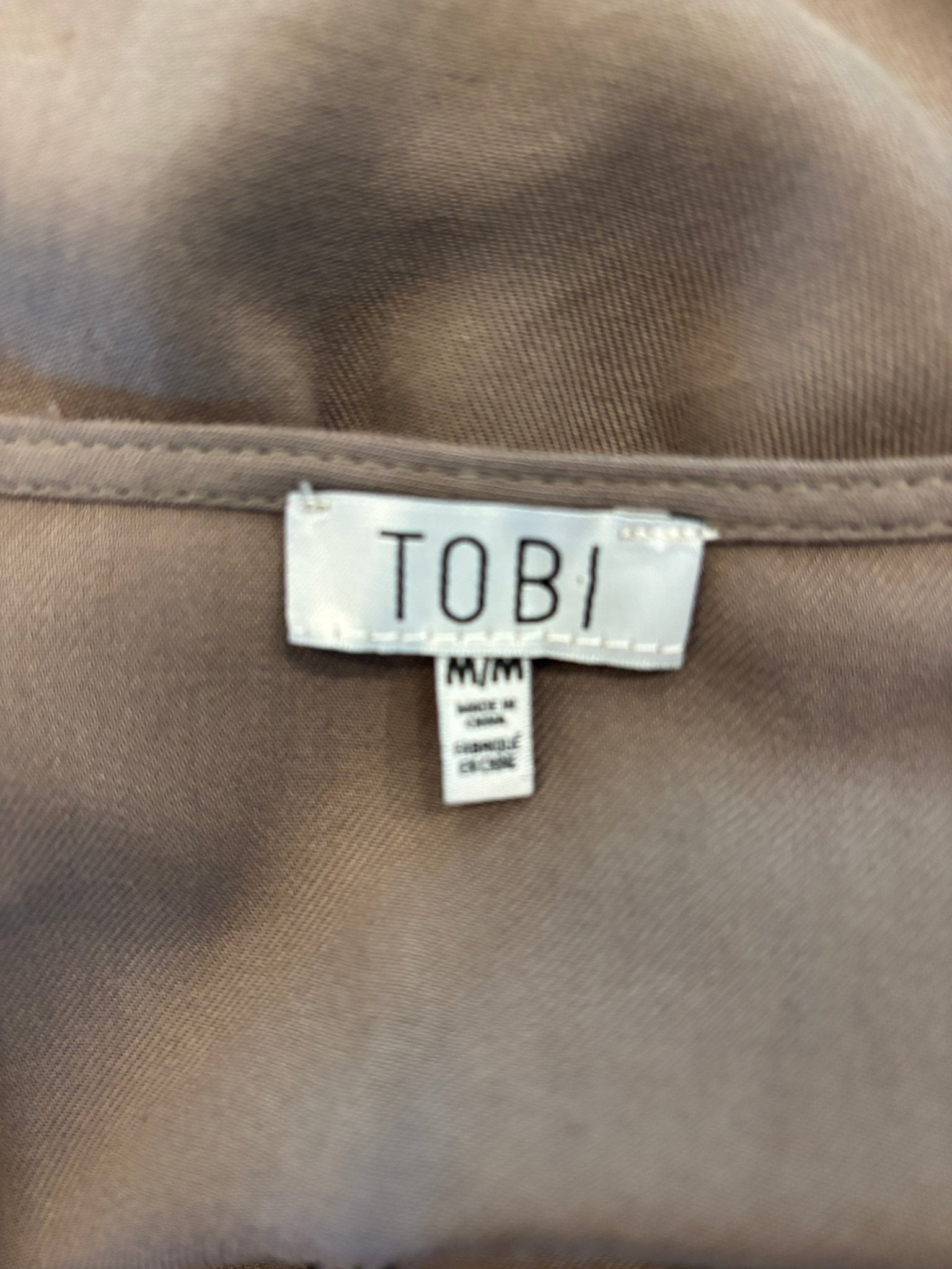 Tobi brand label showing size Medium