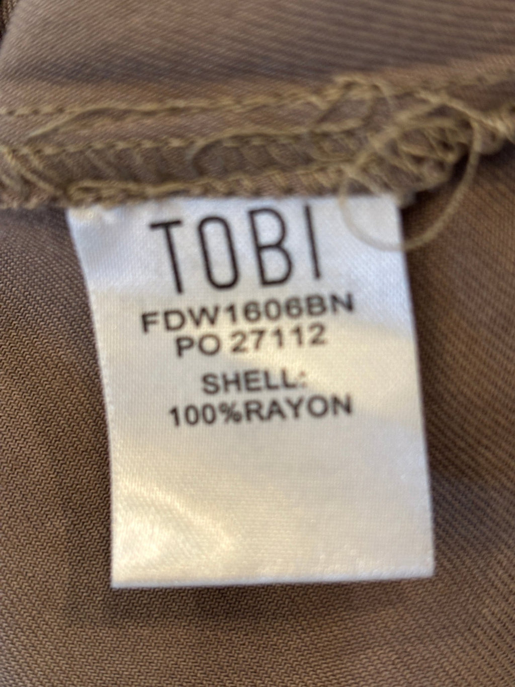Interior fabric label — 100% rayon shell, Tobi style number FDW1606BN