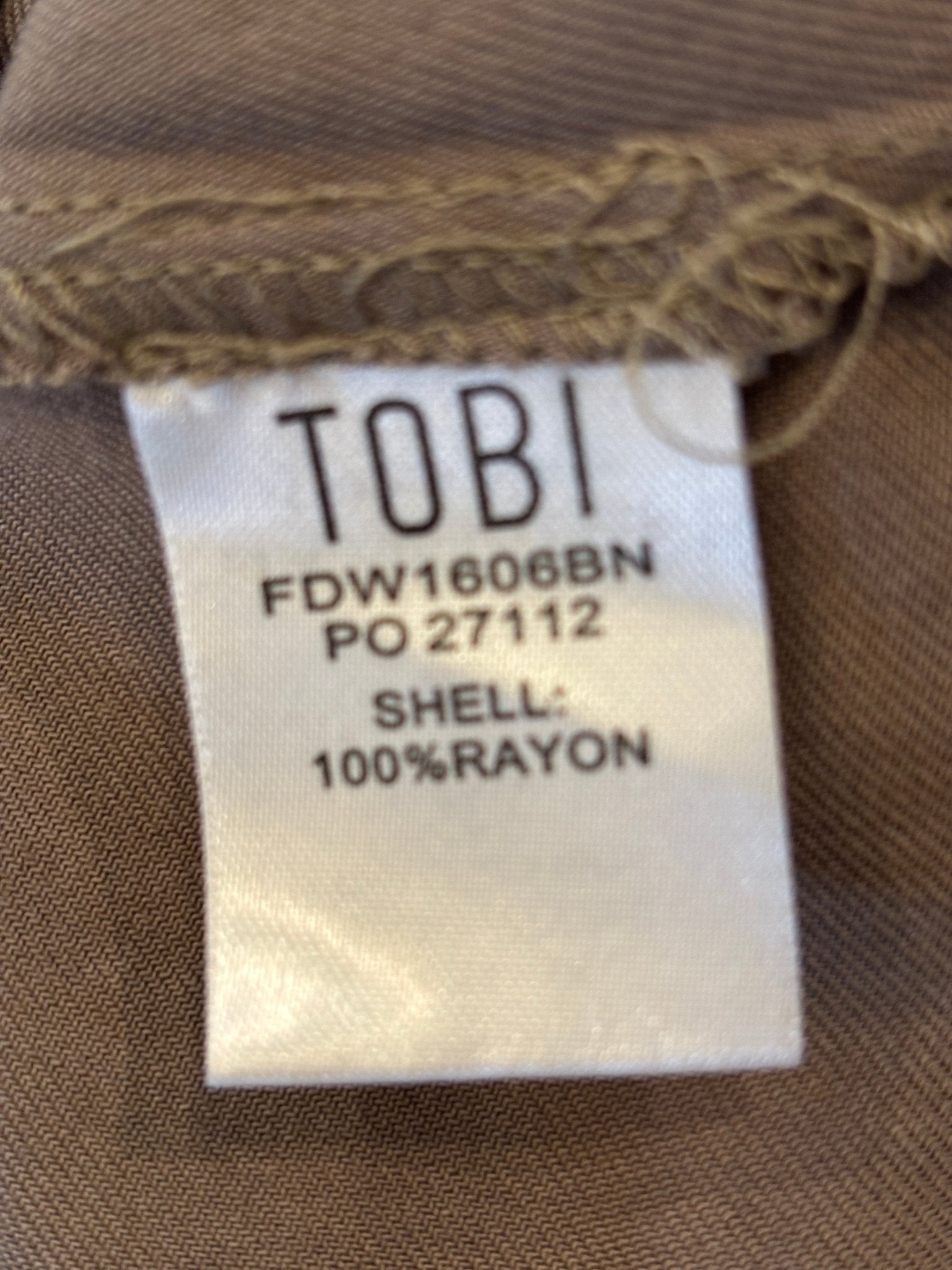 Interior fabric label — 100% rayon shell, Tobi style number FDW1606BN