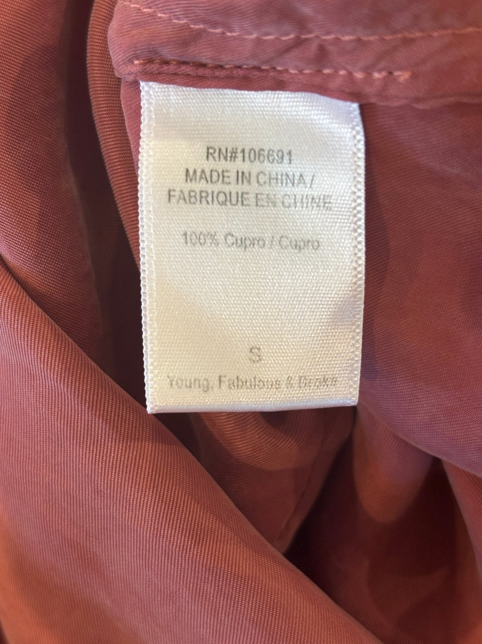 Fabric content label showing 100% cupro, size Small, Young Fabulous & Broke